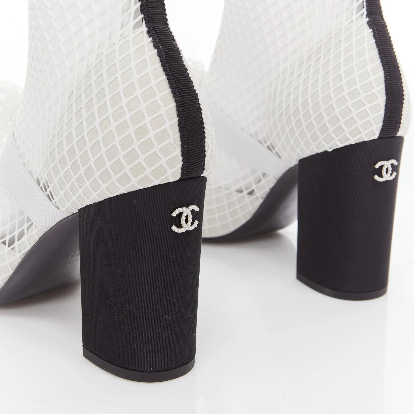 CHANEL 2023 Runway black toe cap white bow CC fishnet thigh high heels EU38.5